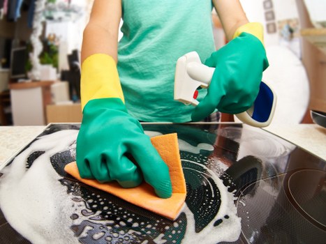Detailed cleaning work on a carpeted area during service delivery